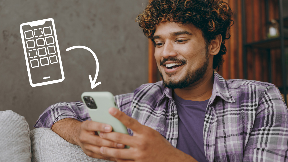 Man customizing iPhone home screen