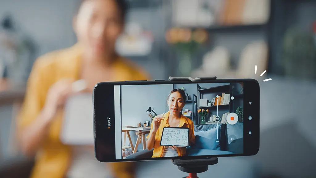 Person repurposing old phone as a webcam