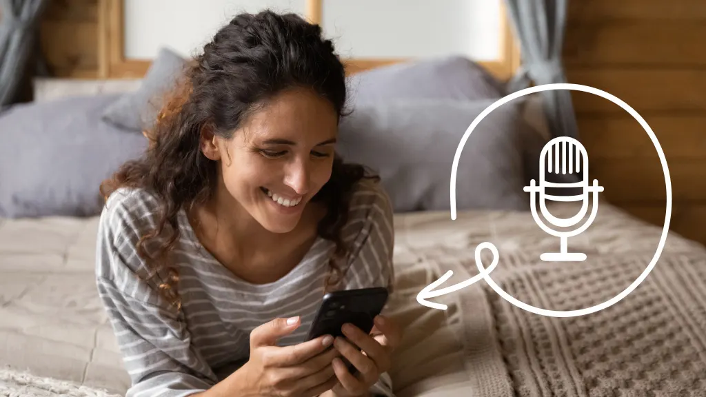 Woman laying on a bed with a phone in her hand with the illustration of microphone