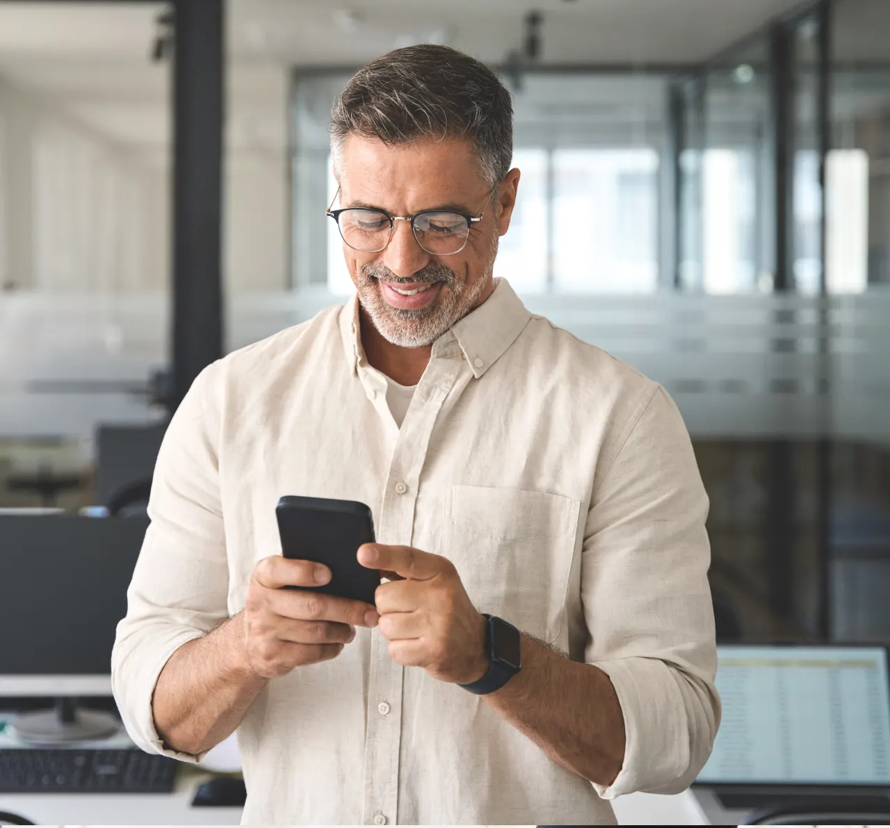 Man using phone and smiling