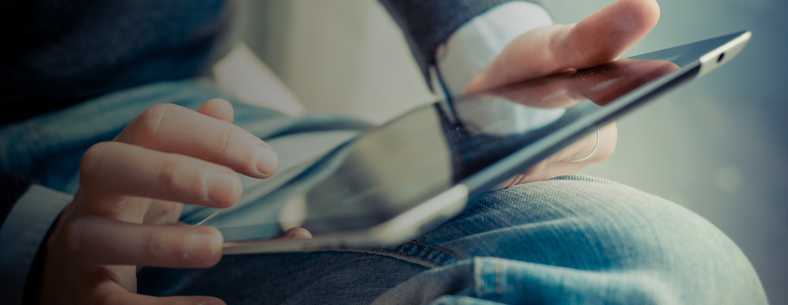 person holding tablet