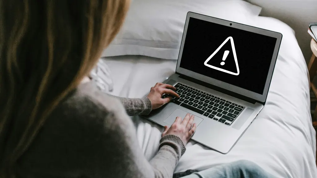 Woman on Chromebook with black screen