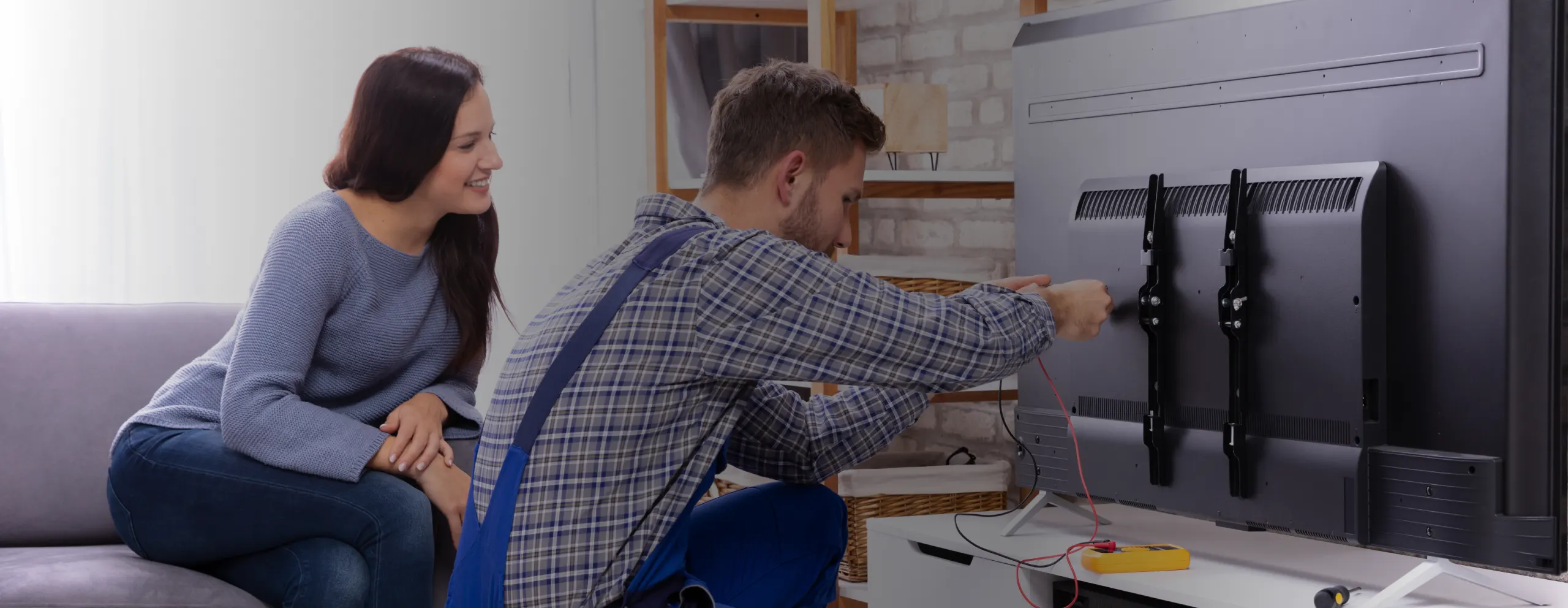 man installing tv