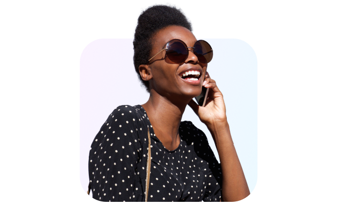 woman wearing sunglasses while on phone