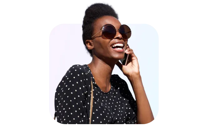 woman wearing sunglasses while on phone