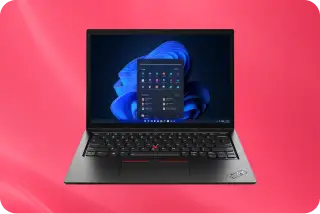 Windows laptop computer with open screen displaying the Windows 11 start menu.