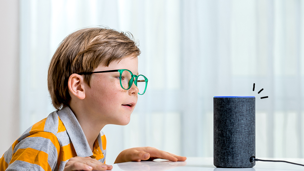 Young boy asking fun question to Alexa smart home hub