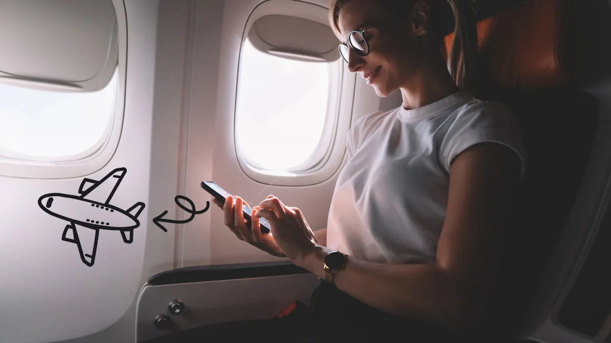 Woman turning on airplane mode in flight 