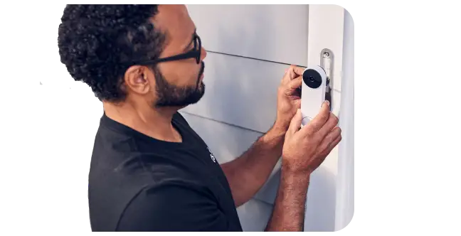 man installing doorbell tech