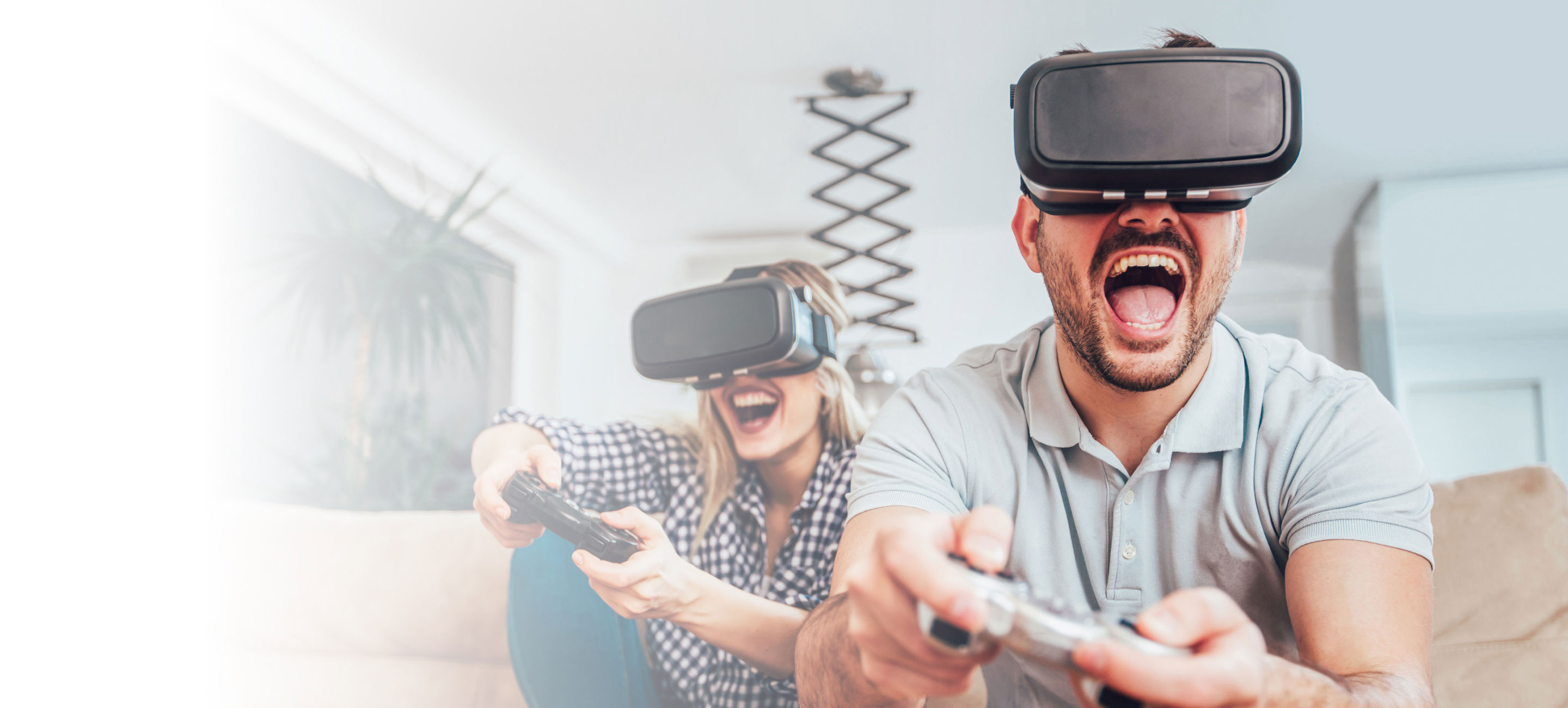 a couple playing video games with VR Gear