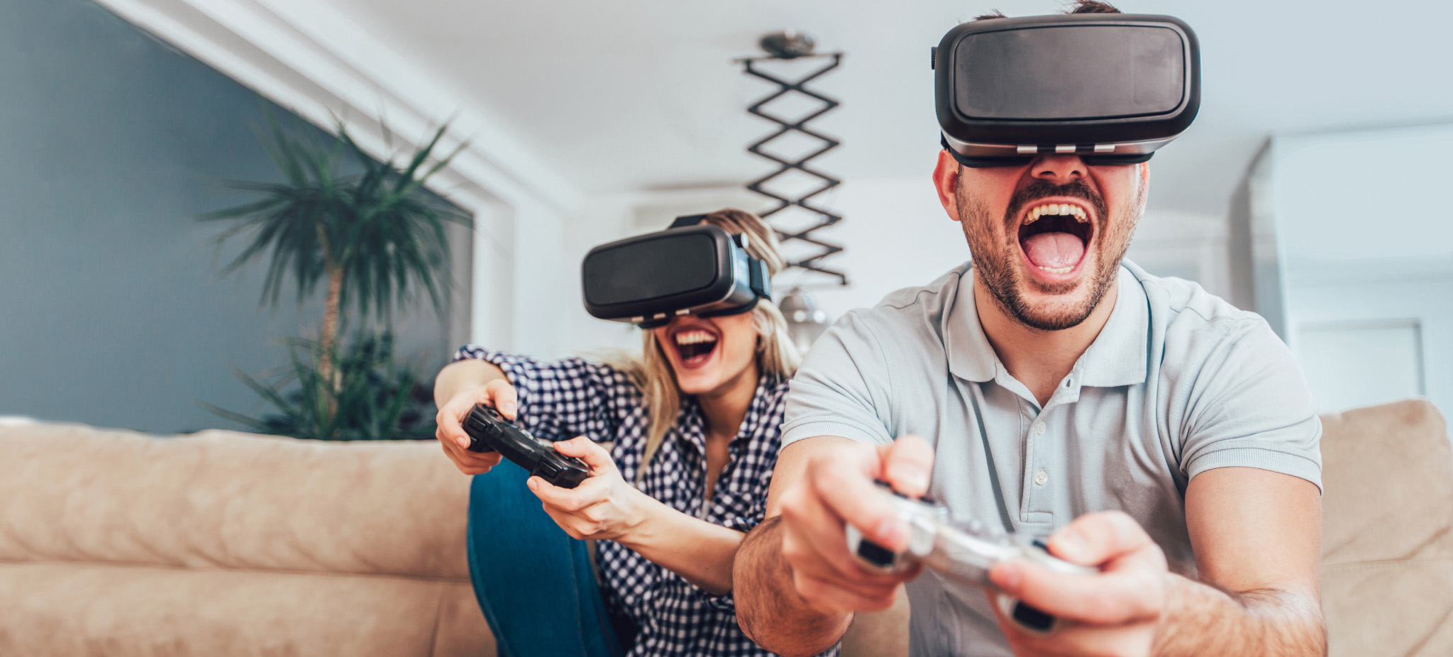 a couple playing video games with VR gear