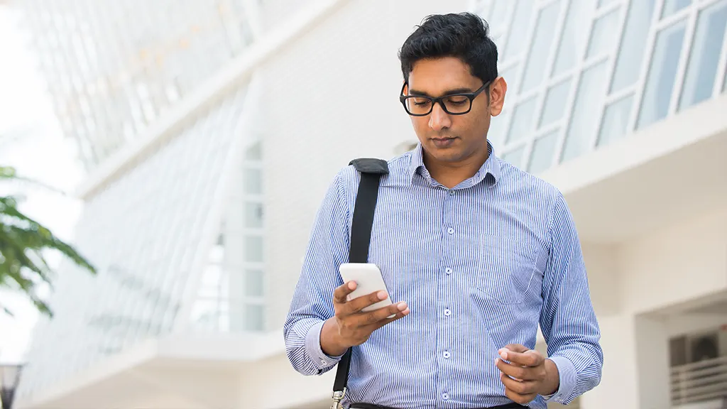 Man looking at Android phone that won't ring