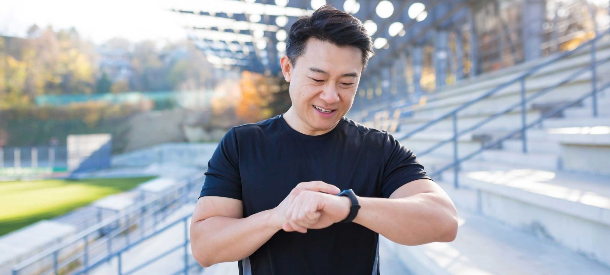 Man looking at his fitness tracker