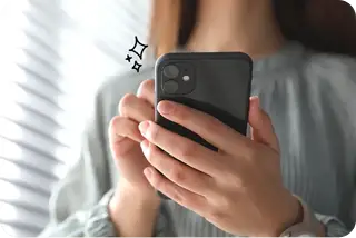 Person holding an iPhone in their hand