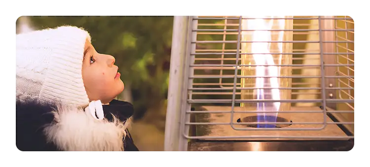 Child looking at a heater