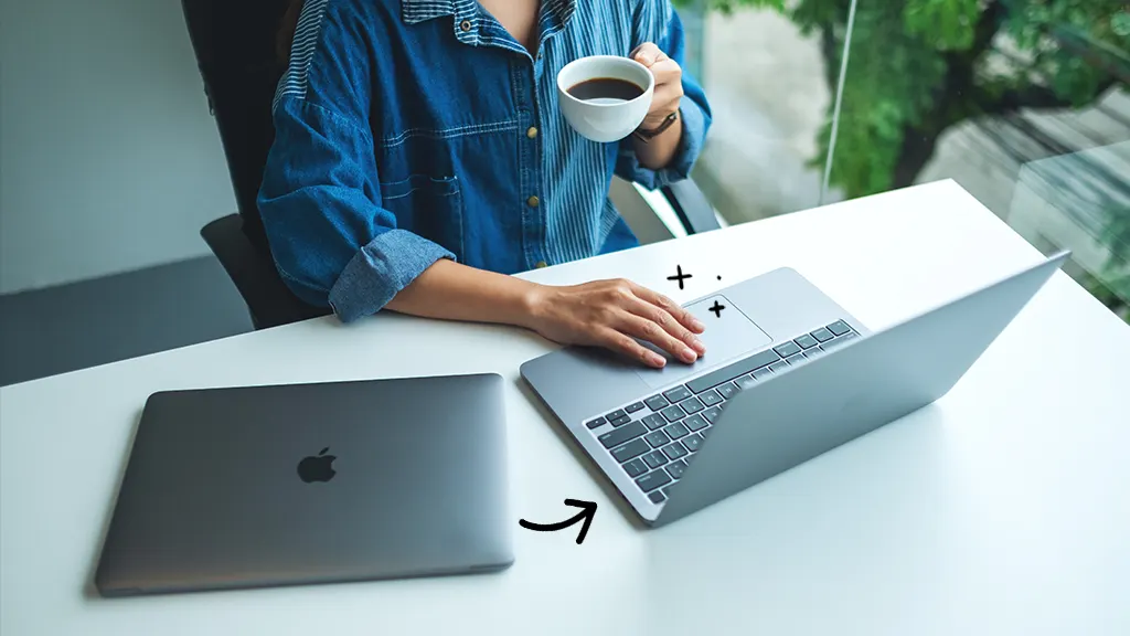 Person recovering data from dead MacBook onto new MacBook