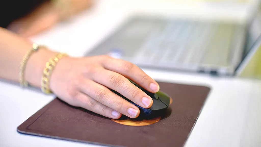 Woman holding wireless mouse 