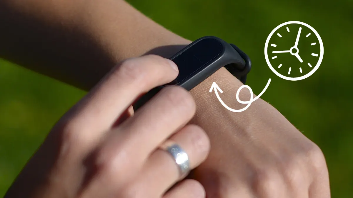 Person changing time on Fitbit