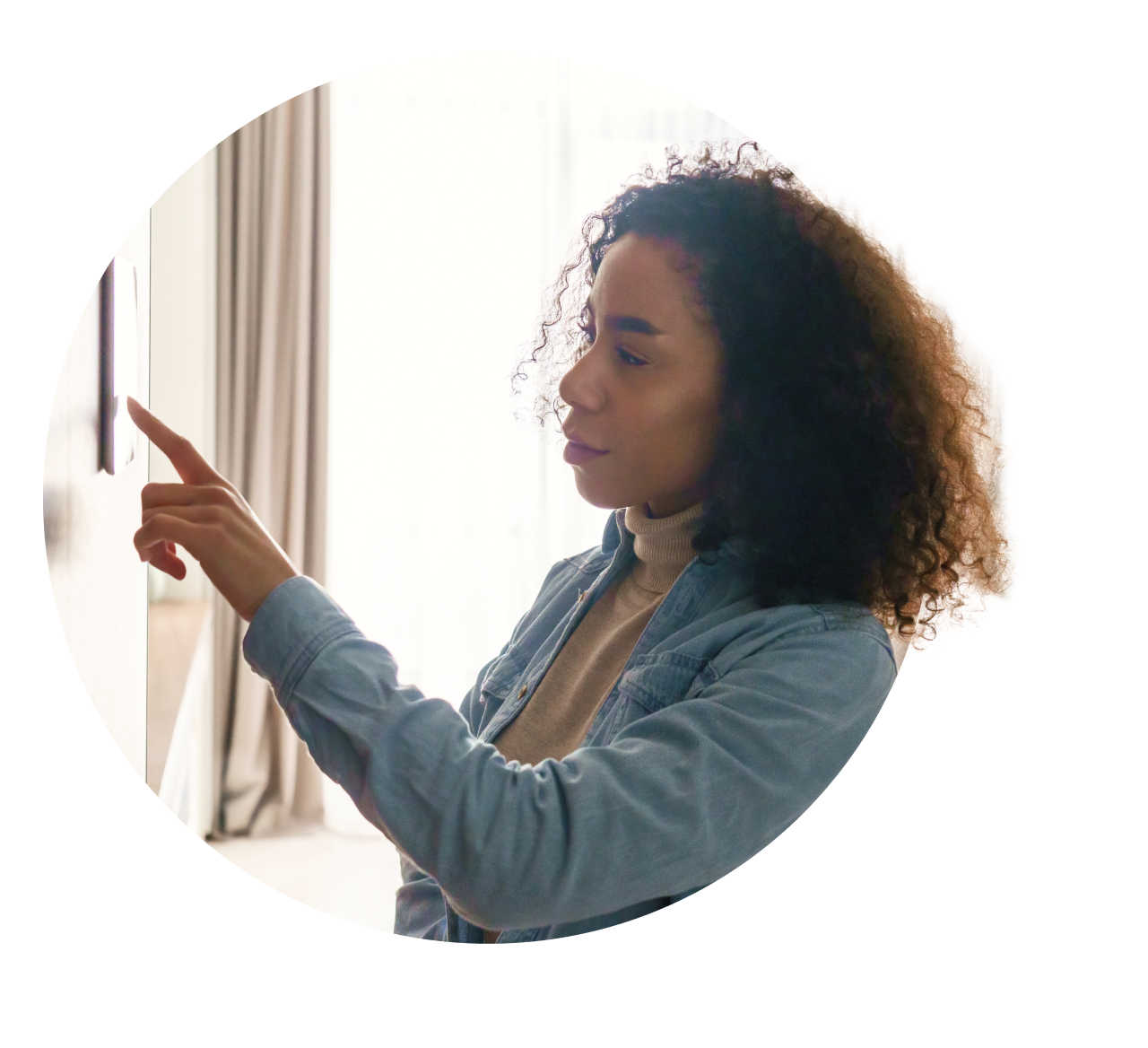 Woman using smart thermostat