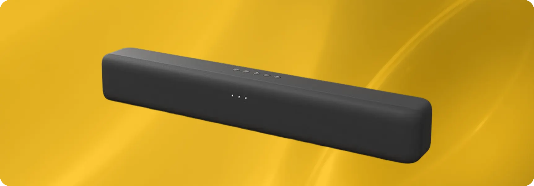 Black soundbar speaker on a yellow background for home audio setup.