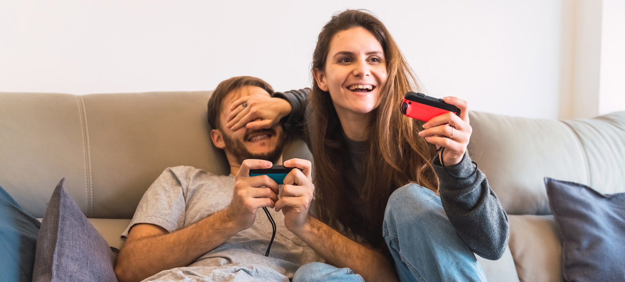 a couple playing video games with Nintendo game consoles