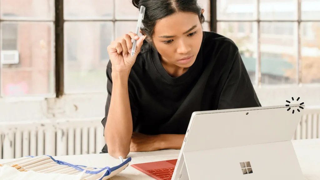 Woman looking at Microsft Surface Laptop