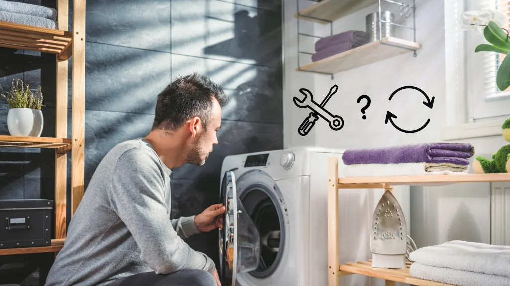 Man looking at dryer that is not working