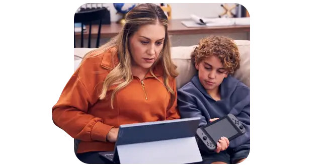 woman and child looking at devices