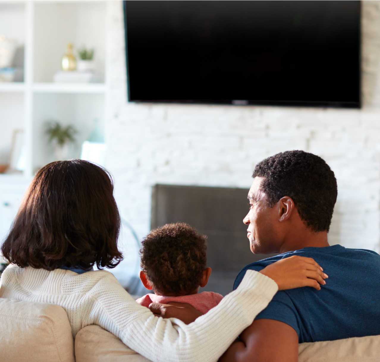 couple on couch watching tv