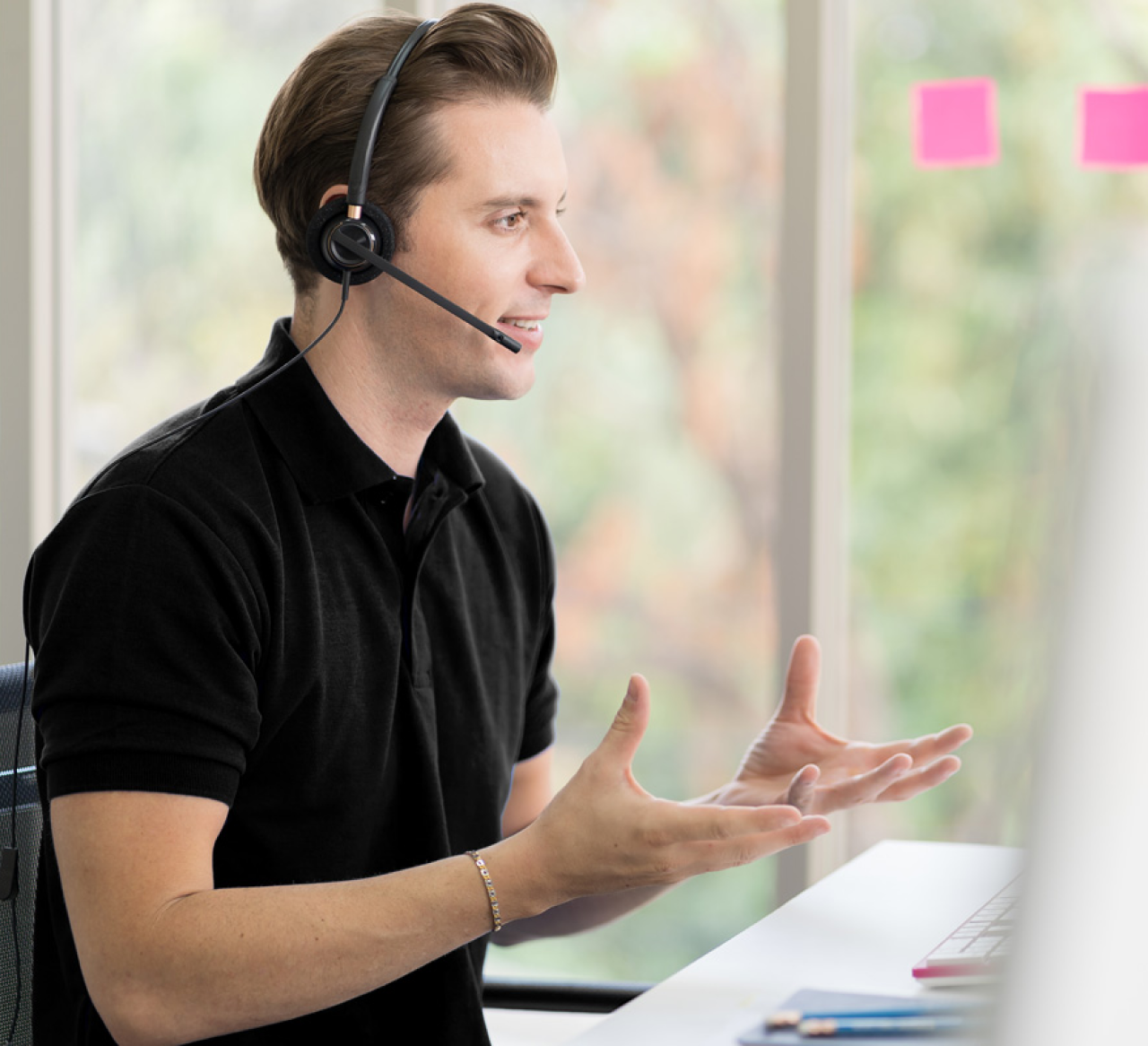 An asurion expert with headsets on talking to a customer