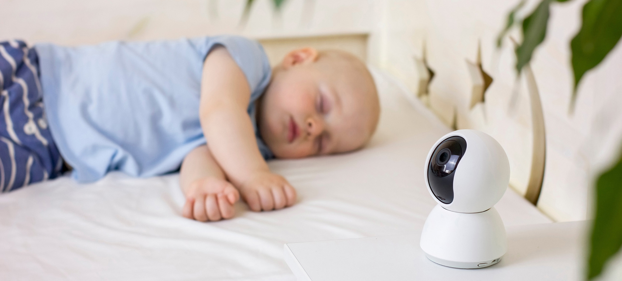 Baby sleeping near baby security monitor