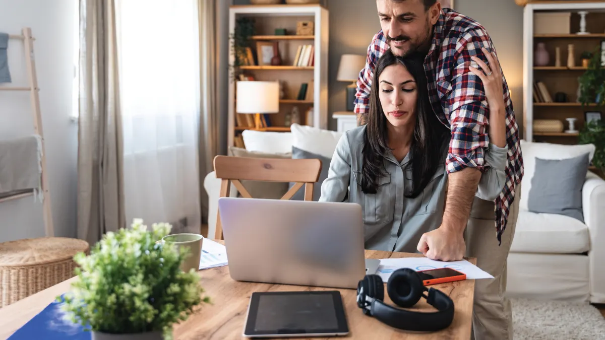 Couple considering Verizon Home Device Protection to protect their home devices