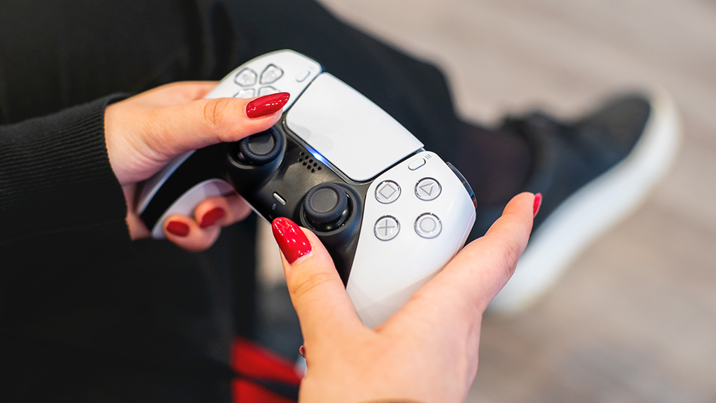Woman with PS5 controller in her hands