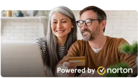 man and woman looking at the laptop