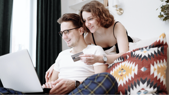 Couple using laptop and credit card - Online shopping