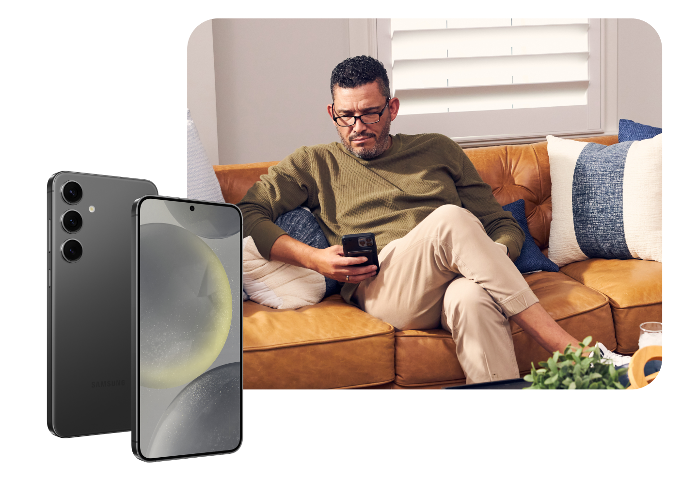 Woman standing in her kitchen looking at her phone while it's charging