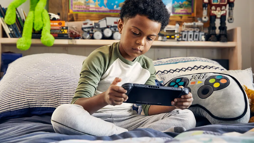 Young boy holding Nintendo Switch that has frozen screen