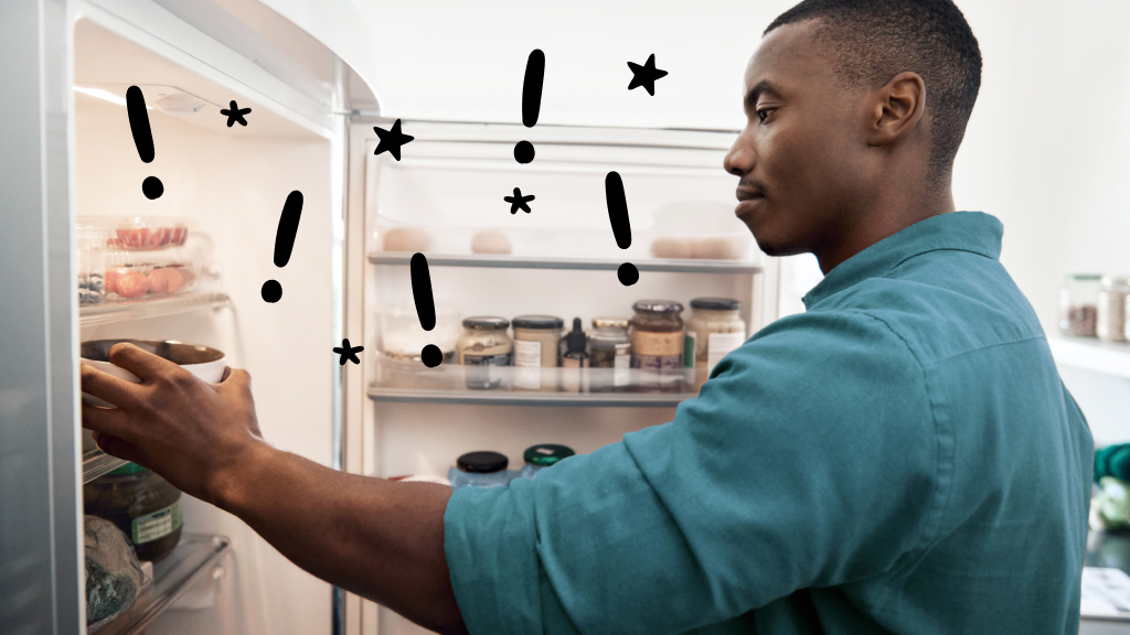 Man looking in refrigerator with issues