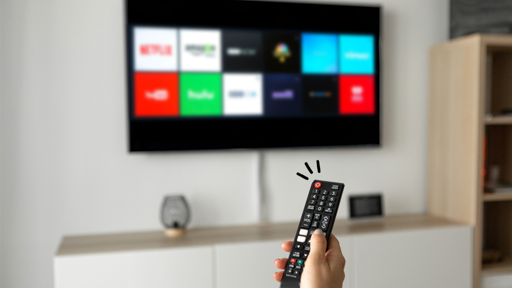 Person pointing TV remote at Samsung TV apps that aren't working