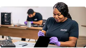 Asurion tech expert fixing a broken tablet