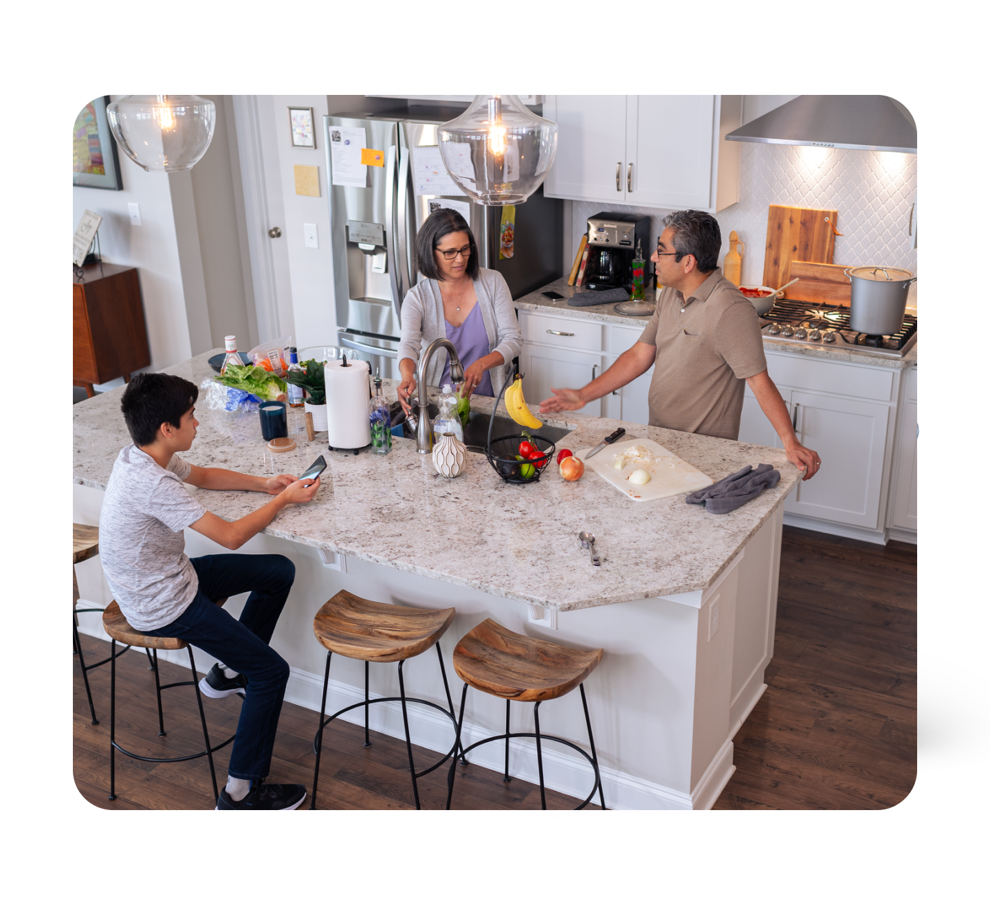 Family talking in kitchen