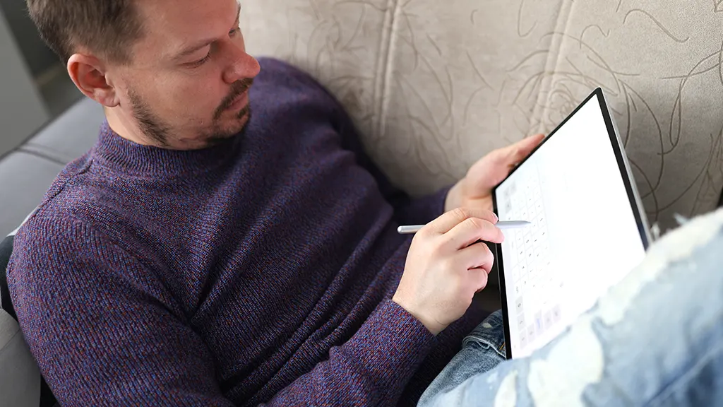 Man holding Samsung tablet that's not holding a charge