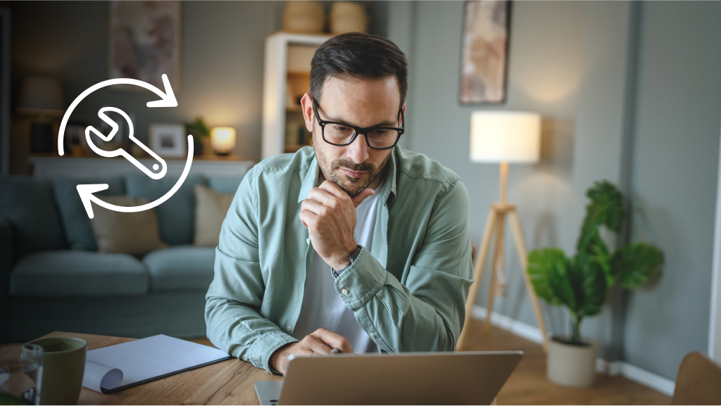 Man on computer with illustration of tools for repair.