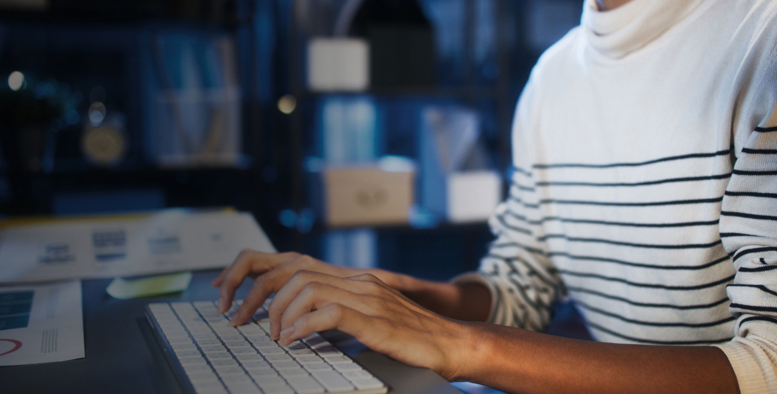 someone typing on desktop keyboard