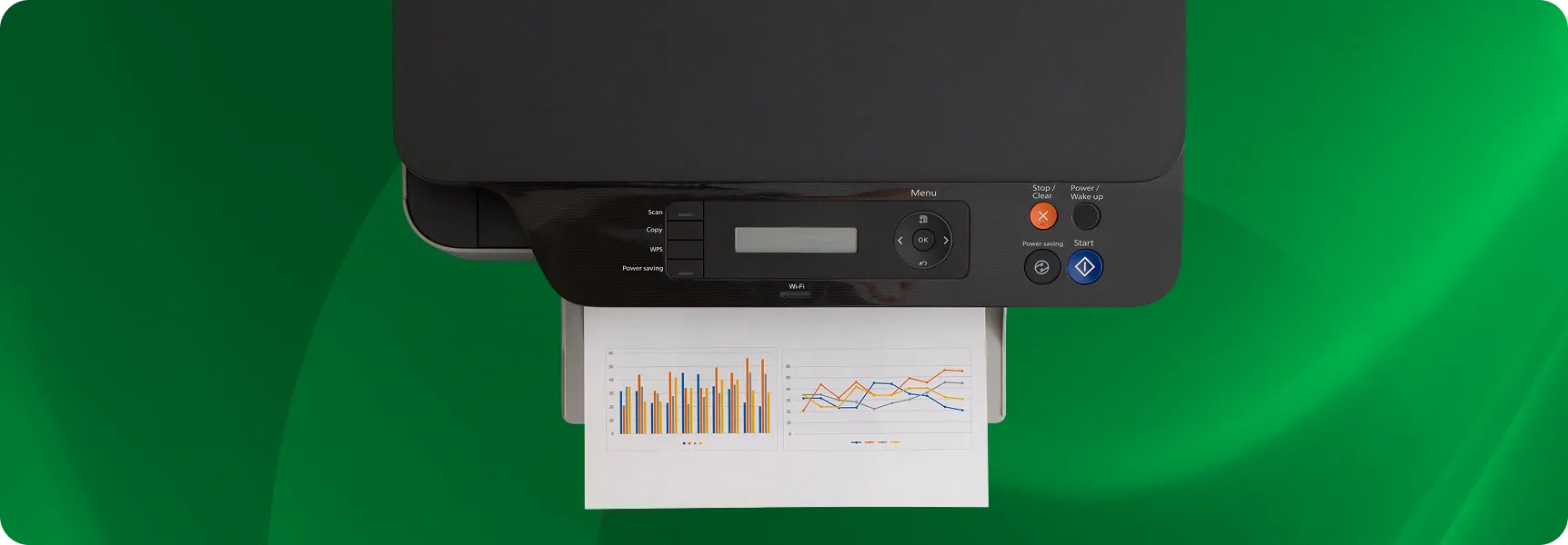 Printer producing a document with charts and graphs.