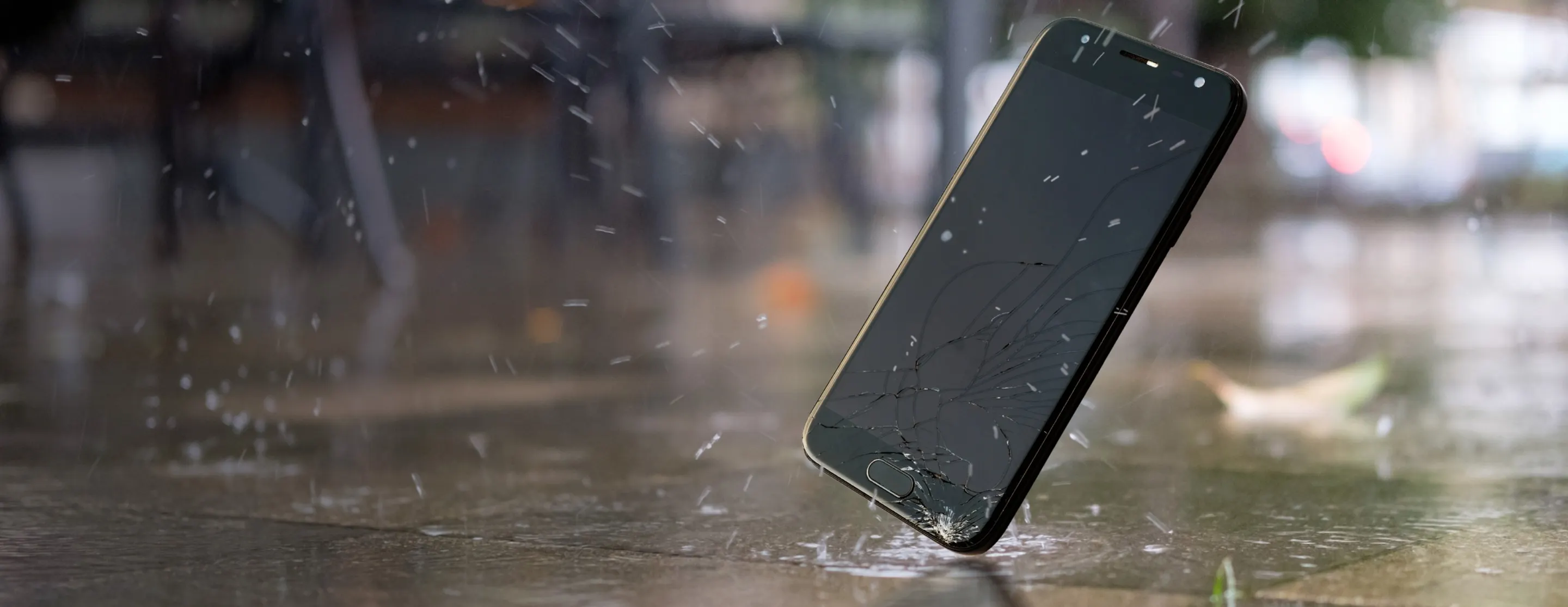 A mobile phone drops down on ground