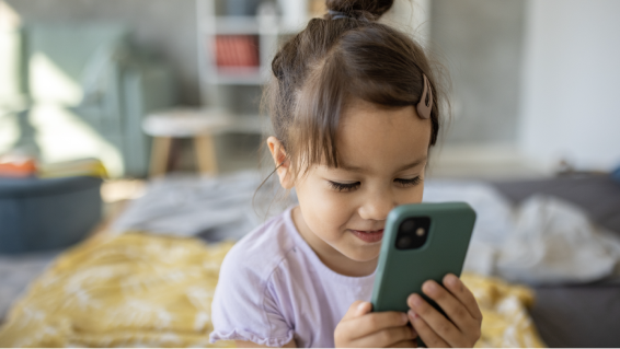 Toddler using a phone