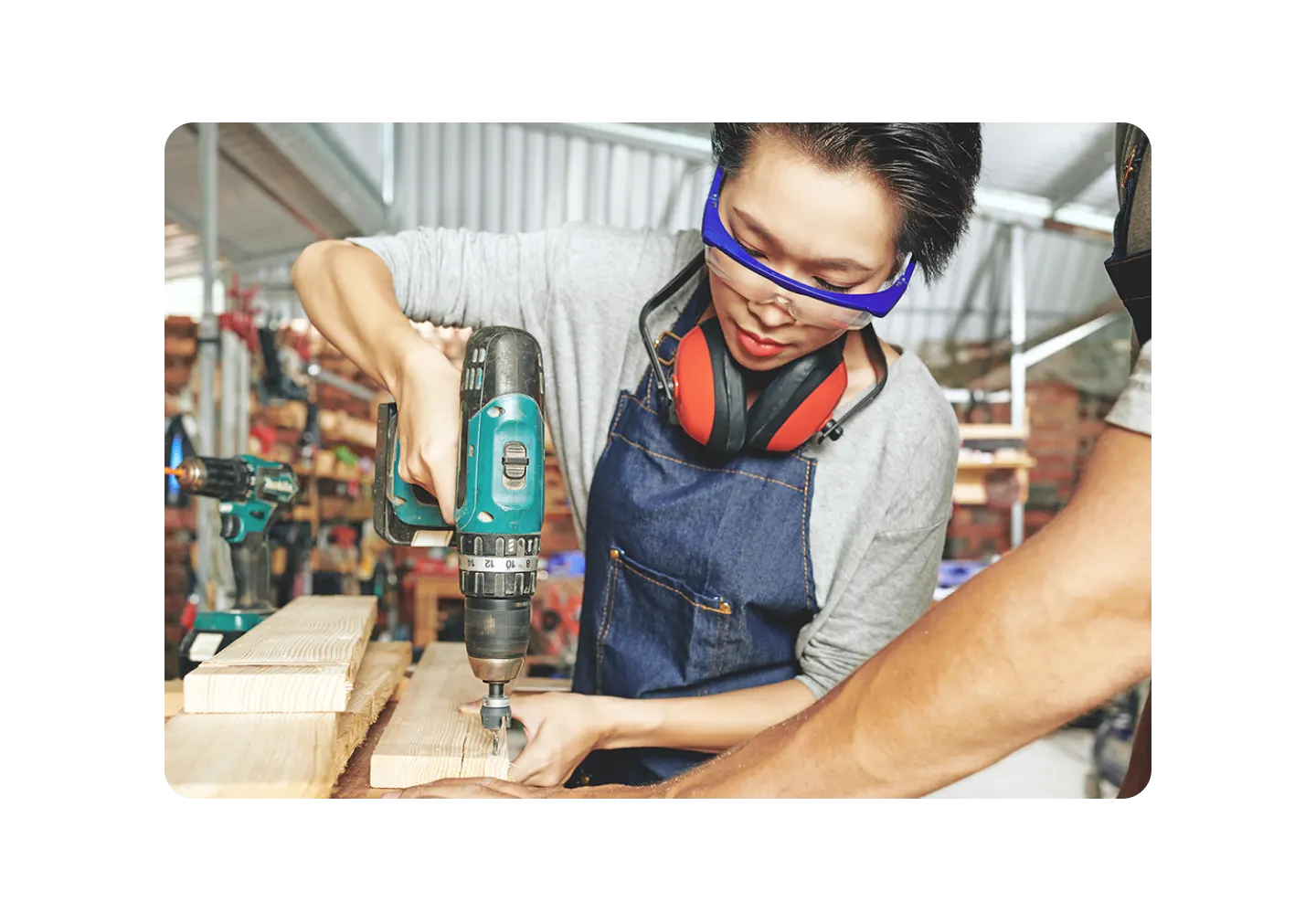 Woman using a drill