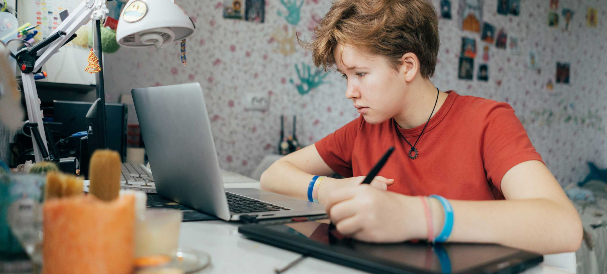 Boy drawing on tablet