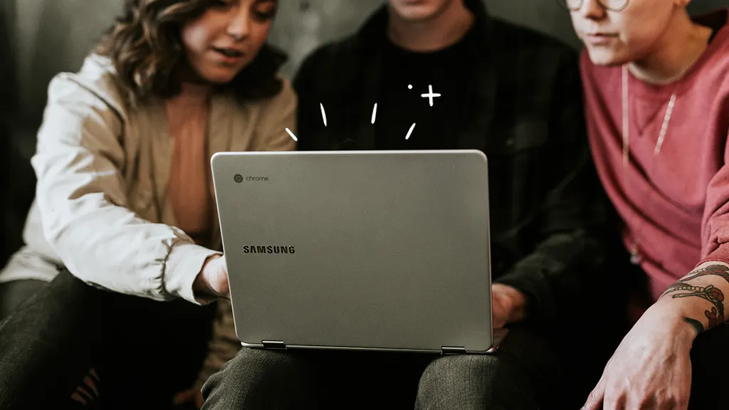 People sitting together and working to speed up a Chromebook 